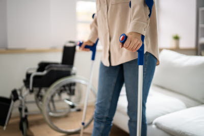 54987409-hurt-leg-using-crutches-near-wheelchair.jpg